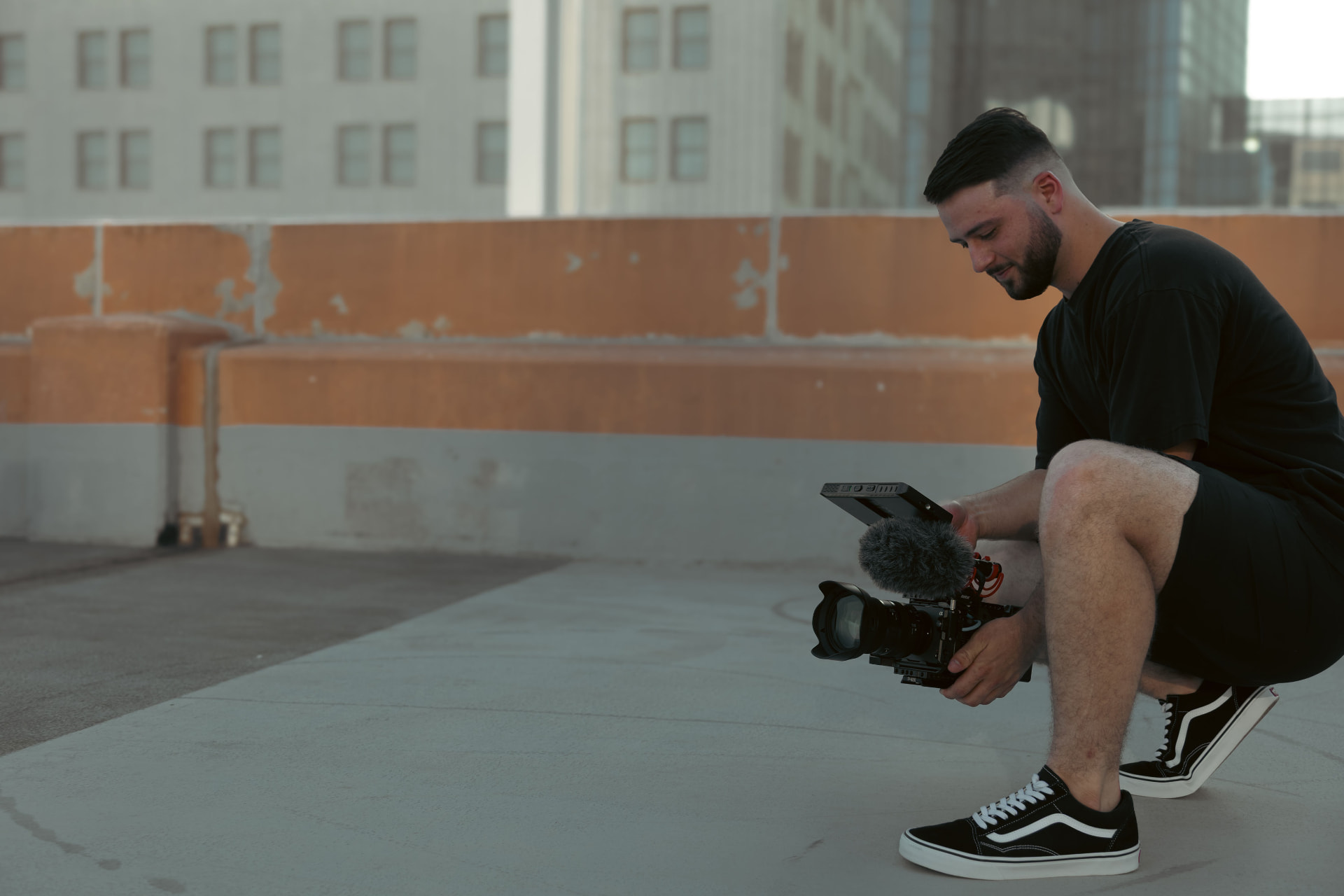 Cody V Smith filming on an Oklahoma City rooftop
